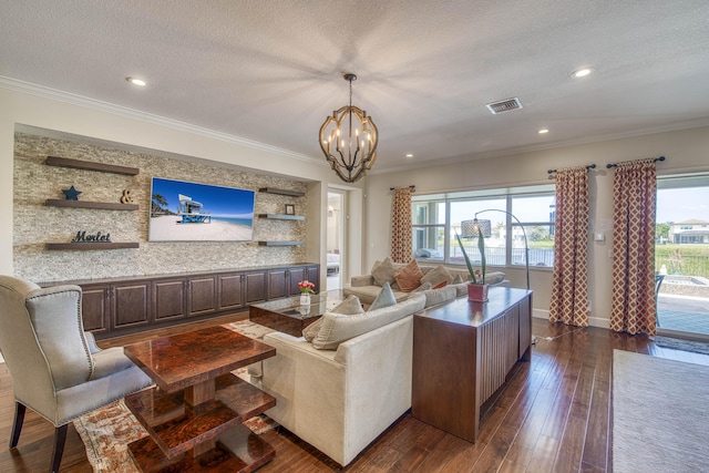 4858 Marginada Way, Lake Worth, FL 33467 - living area with healthy amount of natural light, a chandelier, dark wood-style flooring, crown molding, and a textured ceiling