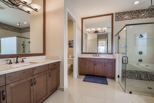 4858 Marginada Way, Lake Worth, FL 33467 - bathroom featuring a chandelier, a stall shower, two vanities, and recessed lighting