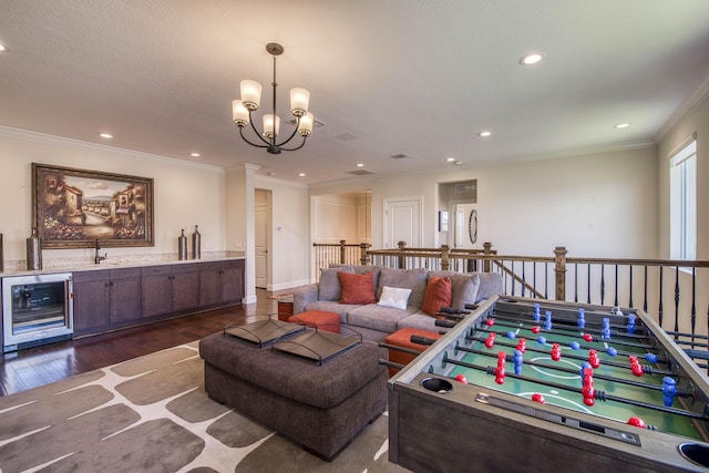4858 Marginada Way, Lake Worth, FL 33467 - game room featuring wine cooler, crown molding, dark wood-type flooring, recessed lighting, and a chandelier
