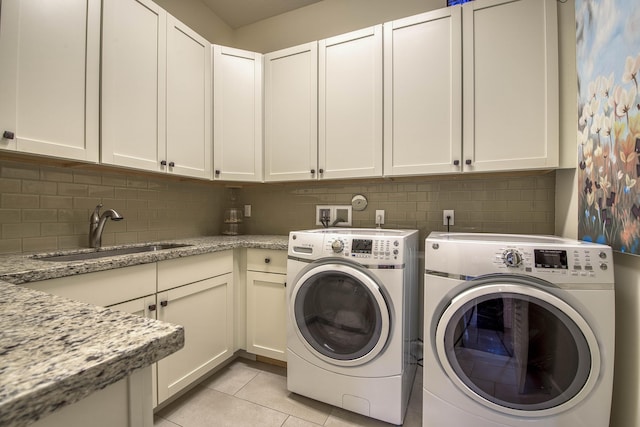 4858 Marginada Way, Lake Worth, FL 33467 - laundry room featuring cabinet space, washer and dryer, and light tile patterned flooring