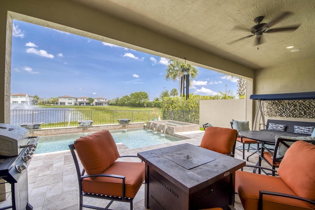 4858 Marginada Way, Lake Worth, FL 33467 - fenced backyard with an in-ground hot tub, a ceiling fan, area for grilling, a patio area, and a water view