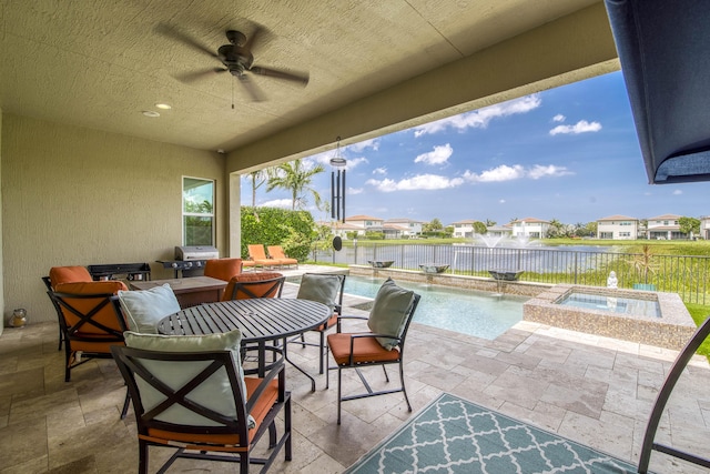 4858 Marginada Way, Lake Worth, FL 33467 - fenced backyard featuring grilling area, a patio area, ceiling fan, a water view, and a pool with connected hot tub