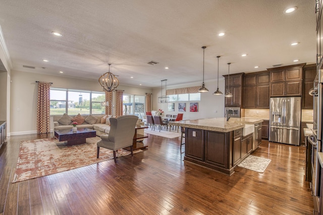 4858 Marginada Way, Lake Worth, FL 33467 - kitchen with stainless steel fridge with ice dispenser, a sink, open floor plan, dark wood finished floors, and crown molding