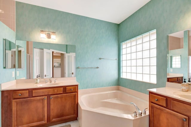 12522 Via Ravenna, Boynton Beach, FL 33436 - full bath featuring plenty of natural light, a bath, two vanities, and wallpapered walls