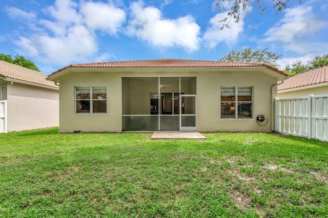 12522 Via Ravenna, Boynton Beach, FL 33436 - rear view of house featuring stucco siding, a tile roof, and a sunroom