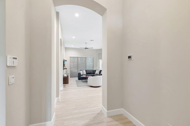 12522 Via Ravenna, Boynton Beach, FL 33436 - hall featuring arched walkways, baseboards, recessed lighting, and light wood-type flooring