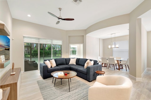 12522 Via Ravenna, Boynton Beach, FL 33436 - living area featuring light wood-style flooring, a ceiling fan, and a chandelier