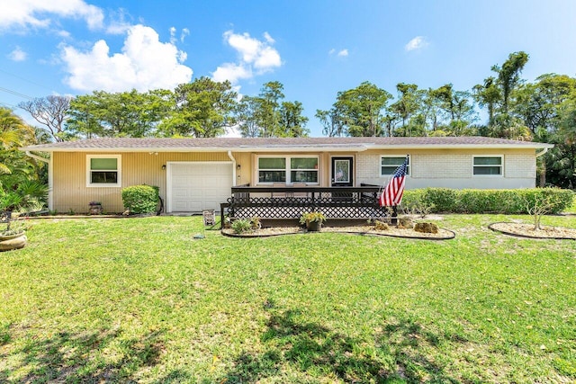 4971 N Kay St, Palm Beach Gardens, FL 33418 - ranch-style home featuring a garage, a front lawn, and brick siding