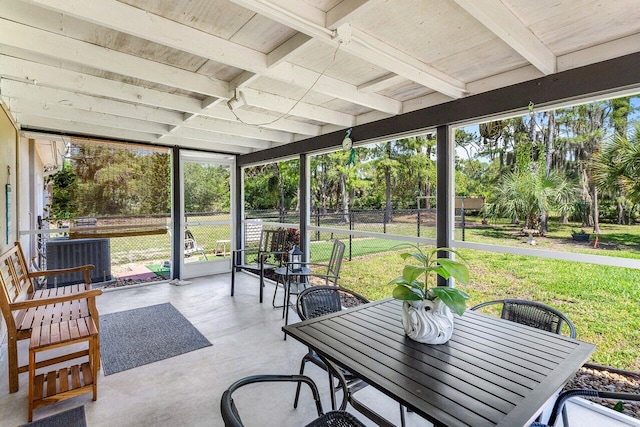 4971 N Kay St, Palm Beach Gardens, FL 33418 - sunroom / solarium with healthy amount of natural light, beamed ceiling, outdoor dining area, and view of scattered trees
