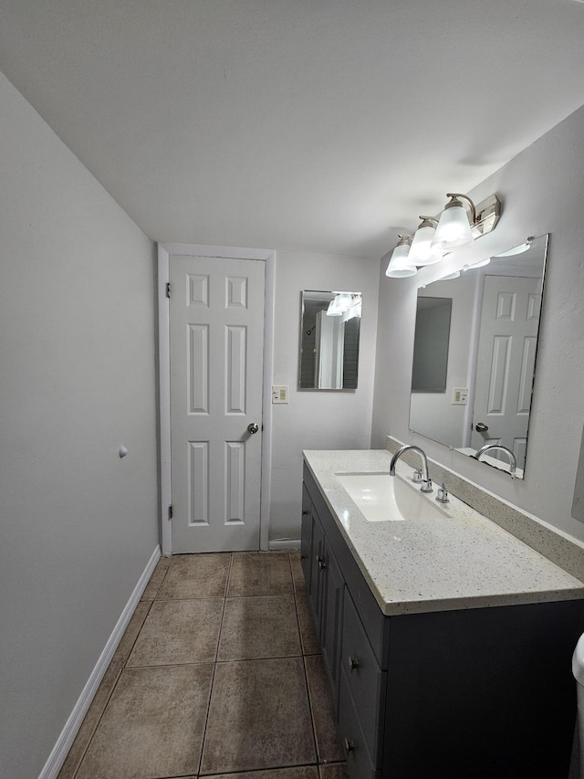 2800 NW 56th Ave Unit C306, Lauderhill, FL 33313 - bathroom featuring vanity, tile patterned flooring, and baseboards