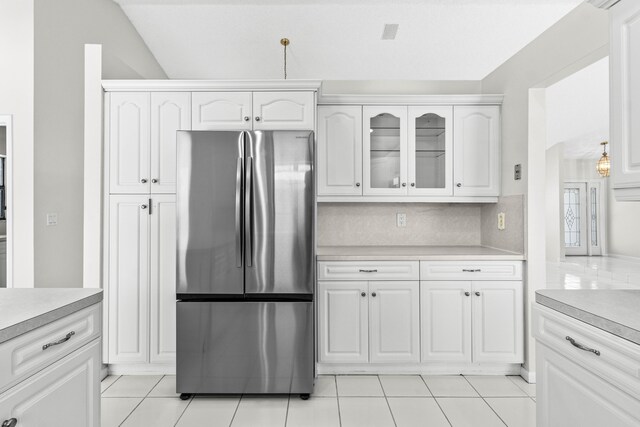 9496 Majestic Way, Boynton Beach, FL 33437 - kitchen featuring freestanding refrigerator, light countertops, and white cabinets