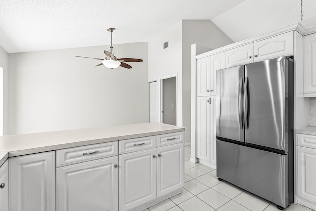 9496 Majestic Way, Boynton Beach, FL 33437 - kitchen featuring freestanding refrigerator, lofted ceiling, a ceiling fan, light countertops, and white cabinetry