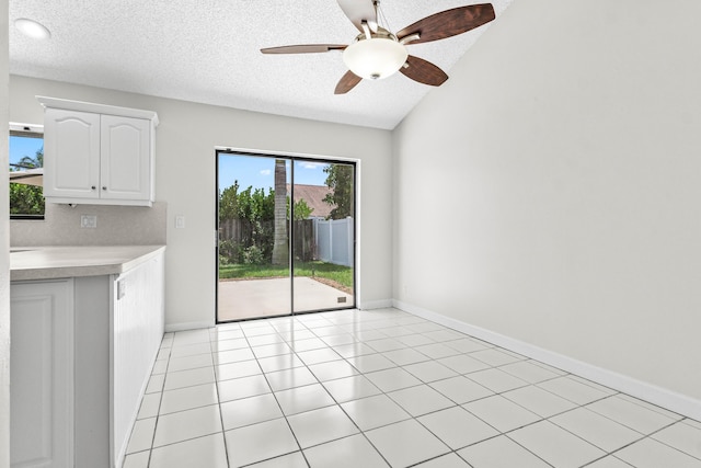9496 Majestic Way, Boynton Beach, FL 33437 - unfurnished dining area featuring a textured ceiling, ceiling fan, and baseboards