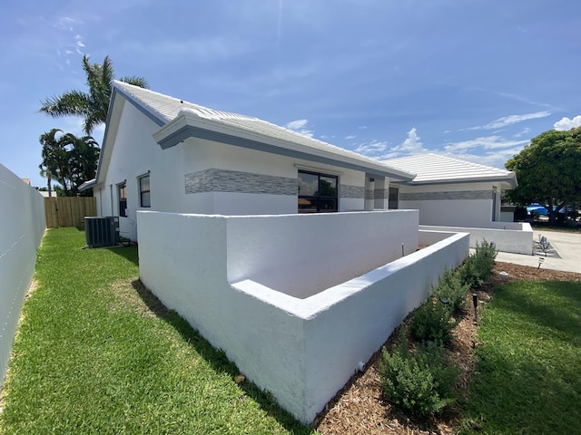 9496 Majestic Way, Boynton Beach, FL 33437 - view of side of property with central AC and stucco siding