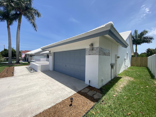 9496 Majestic Way, Boynton Beach, FL 33437 - view of property exterior featuring stucco siding, an attached garage, and concrete driveway