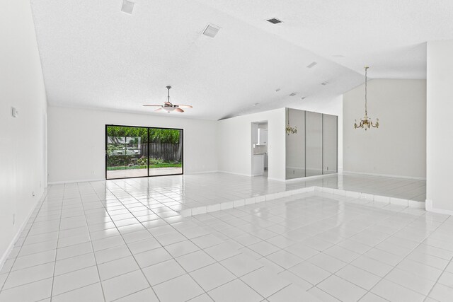 9496 Majestic Way, Boynton Beach, FL 33437 - spare room with light tile patterned flooring, ceiling fan, a chandelier, baseboards, and lofted ceiling