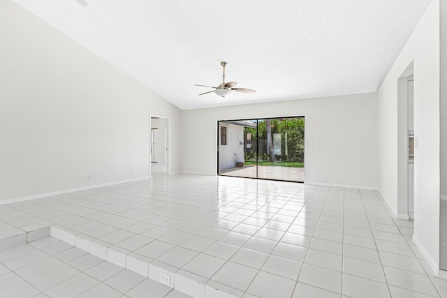 9496 Majestic Way, Boynton Beach, FL 33437 - unfurnished room with ceiling fan, vaulted ceiling, light tile patterned flooring, and baseboards