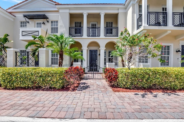 850 NW 83rd Ln, Boca Raton, FL 33487 - view of front of house featuring a balcony and stucco siding