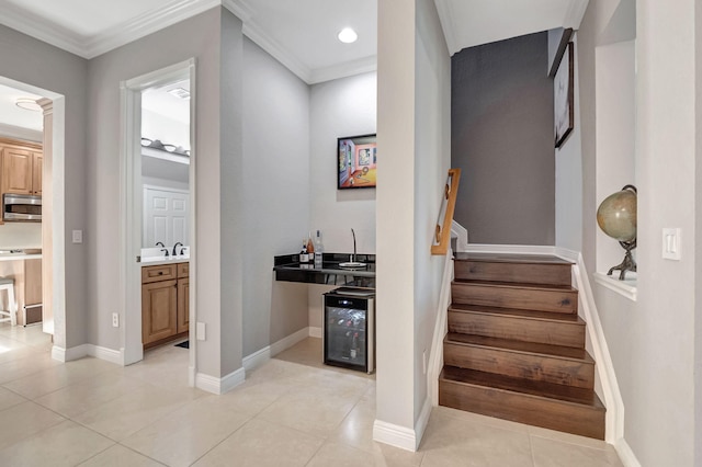 850 NW 83rd Ln, Boca Raton, FL 33487 - staircase with beverage cooler, wet bar, crown molding, tile patterned floors, and baseboards