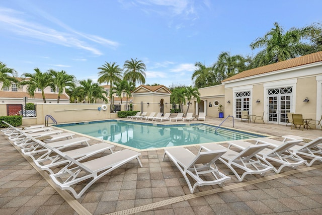850 NW 83rd Ln, Boca Raton, FL 33487 - community pool with french doors and a patio area