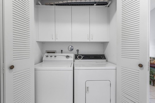 15318 W Tranquility Lake Dr, Delray Beach, FL 33446 - laundry area with cabinet space and washer and dryer