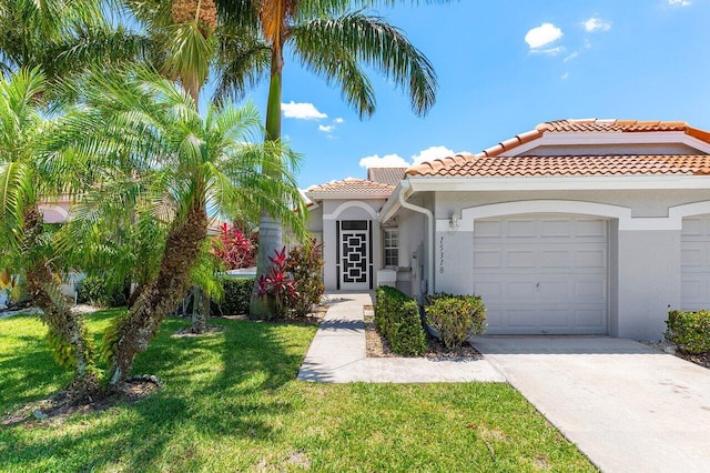 15318 W Tranquility Lake Dr, Delray Beach, FL 33446 - mediterranean / spanish-style house featuring a tiled roof, a garage, driveway, stucco siding, and a front lawn