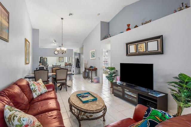 15318 W Tranquility Lake Dr, Delray Beach, FL 33446 - living area with a chandelier, vaulted ceiling, and light tile patterned floors