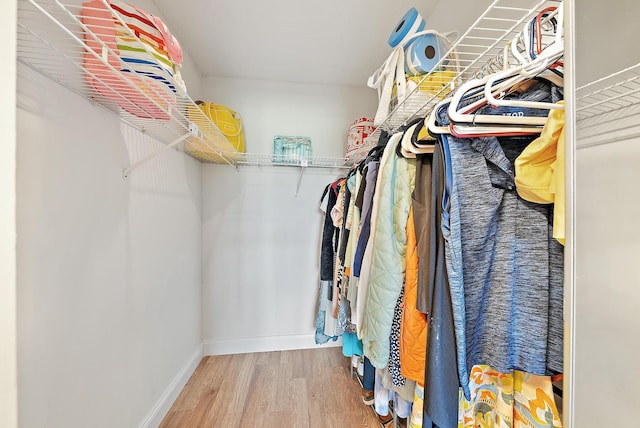 6860 SE Constitution Blvd Unit 204, Hobe Sound, FL 33455 - spacious closet featuring wood finished floors