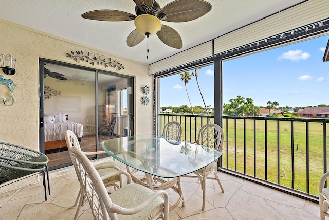 6860 SE Constitution Blvd Unit 204, Hobe Sound, FL 33455 - sunroom featuring a ceiling fan and outdoor dining space