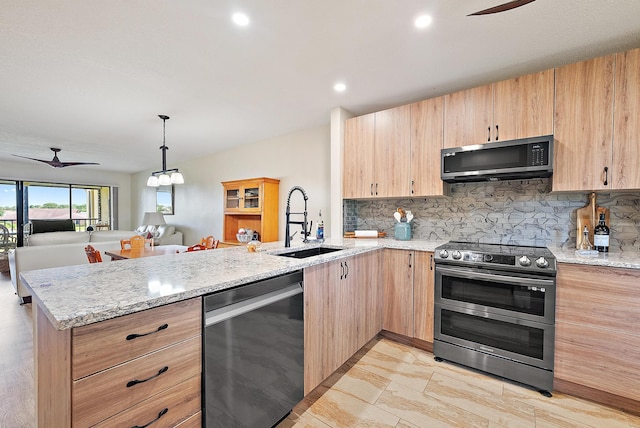 6860 SE Constitution Blvd Unit 204, Hobe Sound, FL 33455 - kitchen featuring stainless steel appliances, light brown cabinetry, a sink, a peninsula, and a ceiling fan