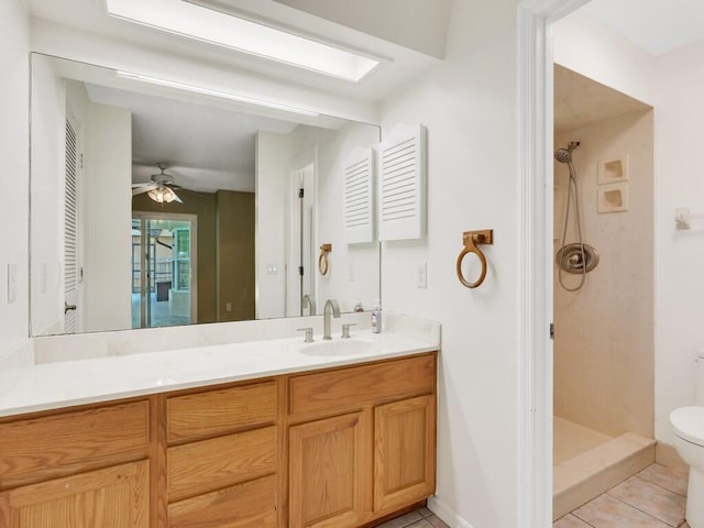 1030 Locust Ave NW, Palm Bay, FL 32907 - full bathroom with a shower stall, vanity, toilet, tile patterned flooring, and ceiling fan
