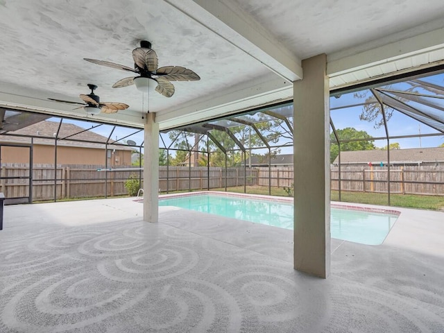 1030 Locust Ave NW, Palm Bay, FL 32907 - view of pool with glass enclosure, a fenced backyard, a patio area, and a ceiling fan