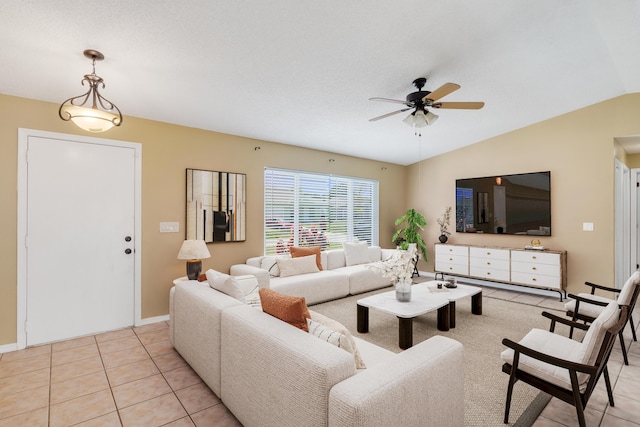 1030 Locust Ave NW, Palm Bay, FL 32907 - living area featuring a ceiling fan, vaulted ceiling, baseboards, and light tile patterned flooring