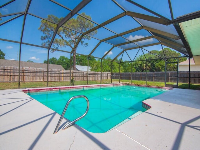 1030 Locust Ave NW, Palm Bay, FL 32907 - view of swimming pool featuring a fenced backyard, a patio area, and glass enclosure