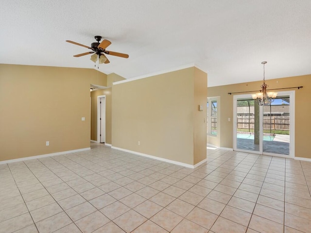 1030 Locust Ave NW, Palm Bay, FL 32907 - empty room featuring a chandelier, a ceiling fan, lofted ceiling, baseboards, and light tile patterned floors