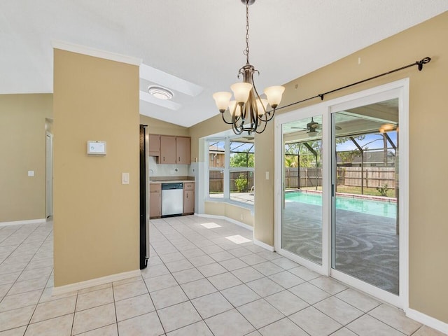 1030 Locust Ave NW, Palm Bay, FL 32907 - kitchen featuring dishwasher, lofted ceiling, light tile patterned floors, baseboards, and a chandelier