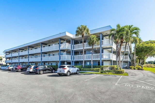 9880 Marina Blvd Unit 1504, Boca Raton, FL 33428 - view of apartment building / complex featuring uncovered parking
