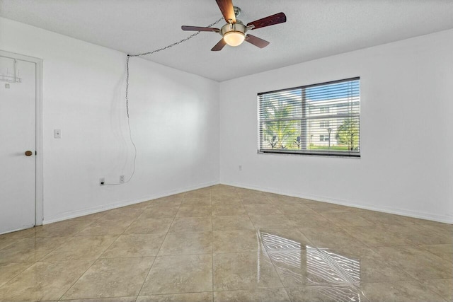 9880 Marina Blvd Unit 1504, Boca Raton, FL 33428 - spare room with ceiling fan, tile patterned floors, and baseboards