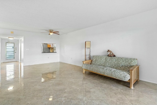 9880 Marina Blvd Unit 1504, Boca Raton, FL 33428 - sitting room featuring a ceiling fan and baseboards