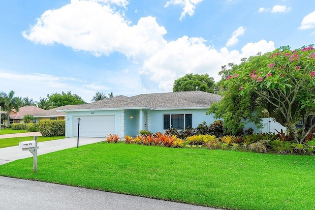 1858 Bartlett Ct, Lake Clarke Shores, FL 33406 - ranch-style home featuring an attached garage, concrete driveway, stucco siding, and a front lawn