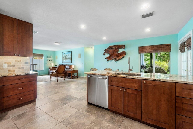 1858 Bartlett Ct, Lake Clarke Shores, FL 33406 - kitchen with dishwasher, a sink, light stone countertops, recessed lighting, and decorative backsplash