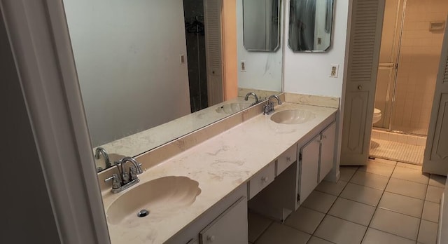 3485 Stanton Ter, Lake Worth, FL 33467 - full bath with double vanity, toilet, a stall shower, and tile patterned flooring