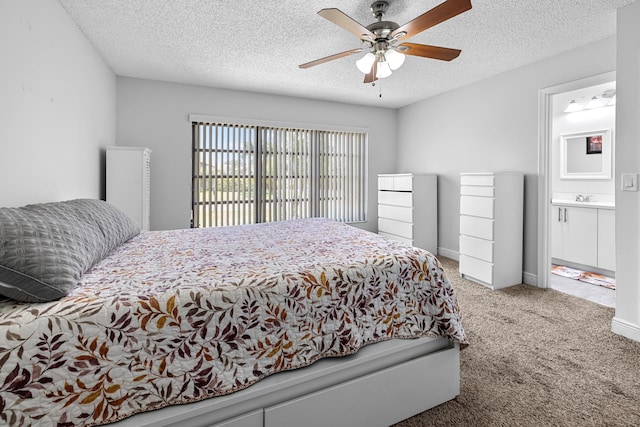 5135 Mirror Lakes Blvd, Boynton Beach, FL 33472 - bedroom with carpet floors, a sink, a textured ceiling, ceiling fan, and ensuite bath
