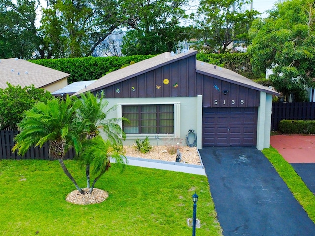 5135 Mirror Lakes Blvd, Boynton Beach, FL 33472 - view of front of property with board and batten siding and driveway