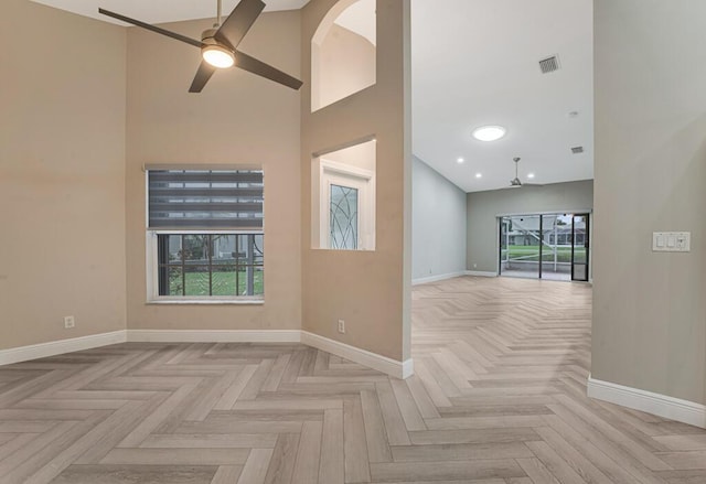 8592 Logia Cir, Boynton Beach, FL 33472 - empty room featuring ceiling fan, baseboards, high vaulted ceiling, plenty of natural light, and recessed lighting