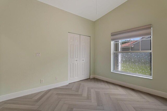 8592 Logia Cir, Boynton Beach, FL 33472 - unfurnished bedroom with baseboards and a closet