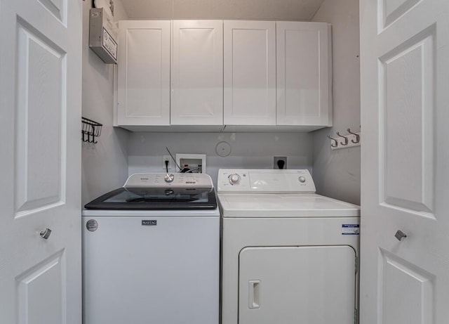 8592 Logia Cir, Boynton Beach, FL 33472 - laundry area featuring cabinet space and washer and dryer