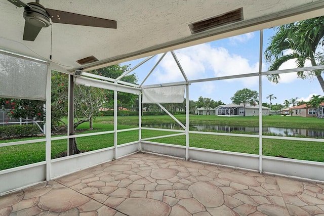 8592 Logia Cir, Boynton Beach, FL 33472 - unfurnished sunroom with a ceiling fan and a water view