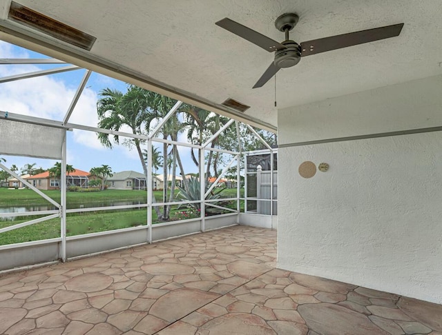 8592 Logia Cir, Boynton Beach, FL 33472 - unfurnished sunroom featuring a ceiling fan, a water view, and a residential view