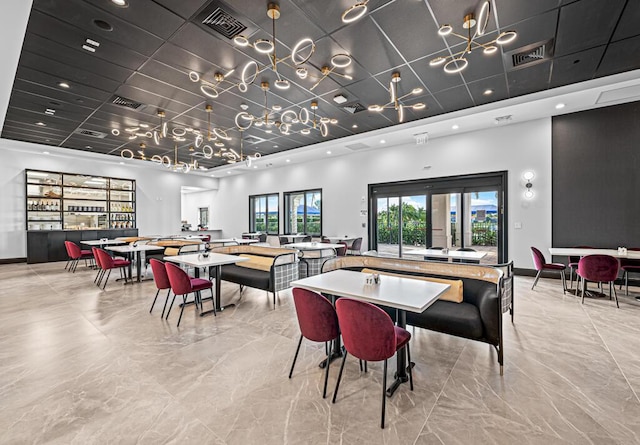 8592 Logia Cir, Boynton Beach, FL 33472 - dining space featuring light marble finish flooring, recessed lighting, and baseboards